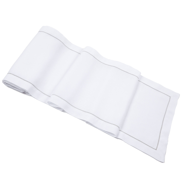 white linen table runner with sage green trim hemstitch
