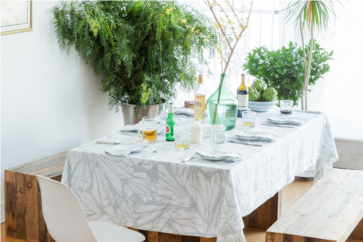 Entertaining inspiration - leafy garden room featuring aqua teal organic abstract printed linen tablecloth and napkins by Huddleson 