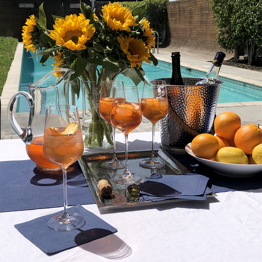 Navy Blue and White Italian Linens Cocktail Napkins Summer Entertaining Cocktails by the Pool Aperol Spritz Vacay Pool Party Sunflowers Citrus Outdoor Guide 